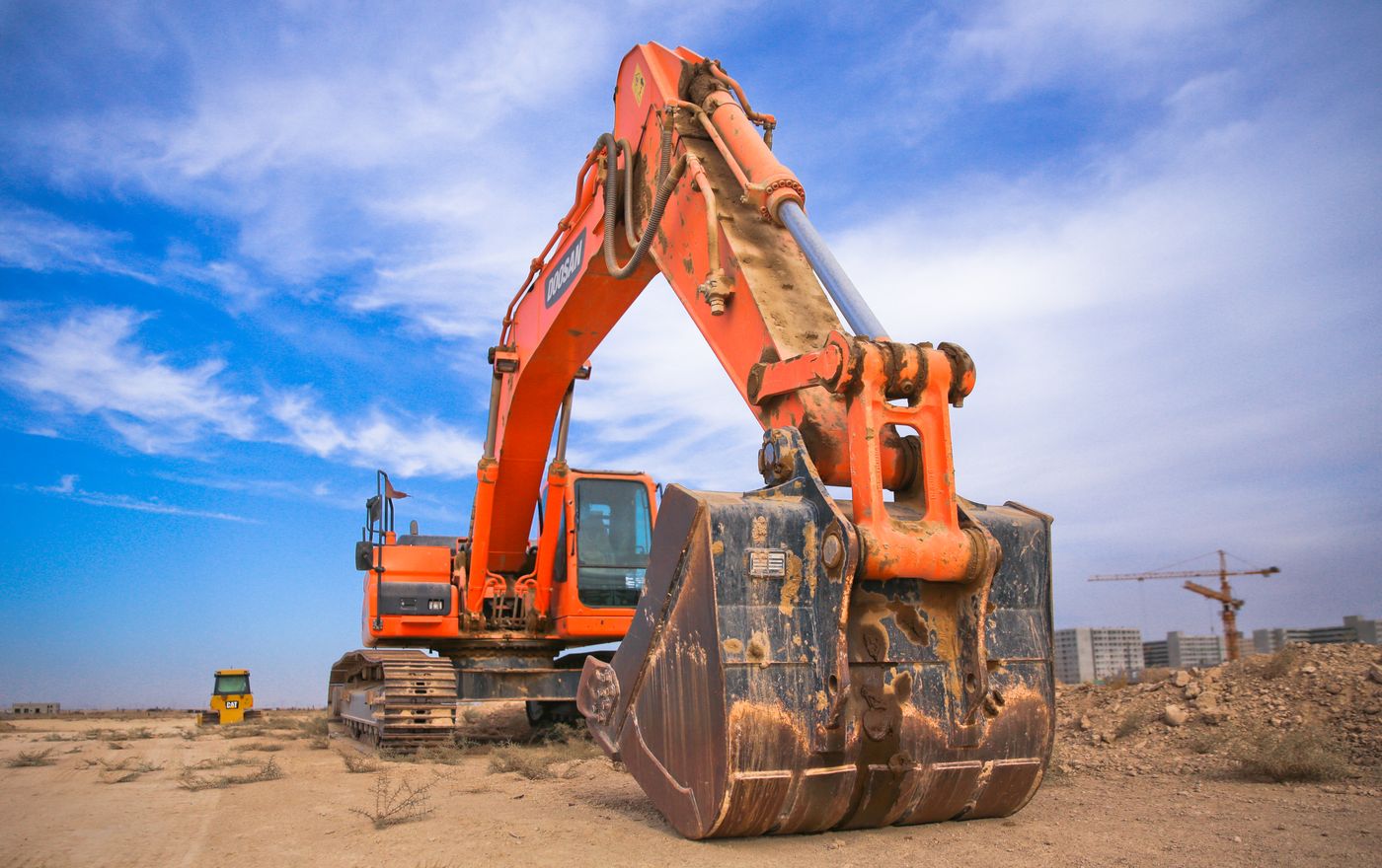 Excavator digging earth for site preparation in Belgrade, MT